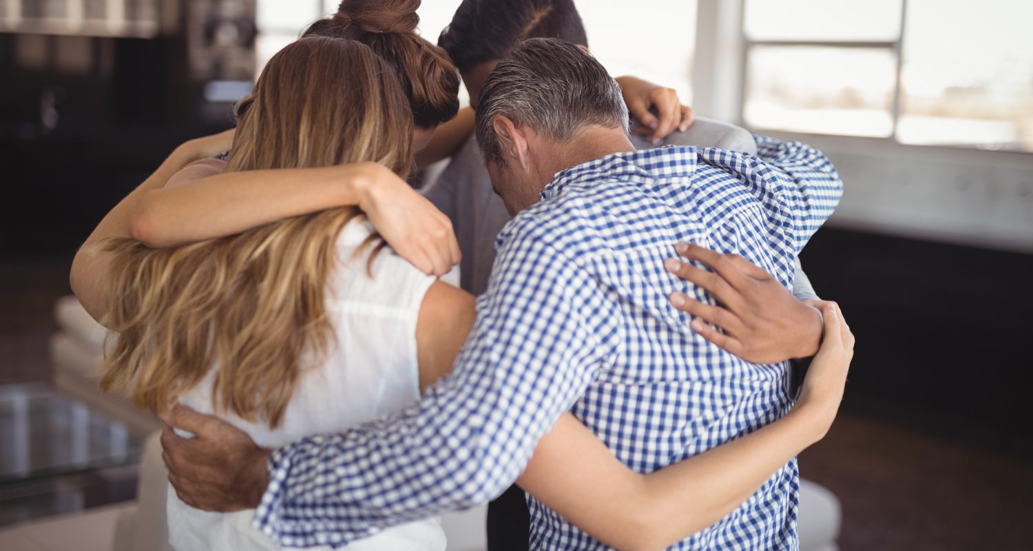 Business people huddling together at creative office