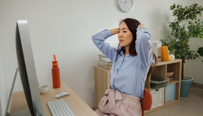 Stressed woman working at home office