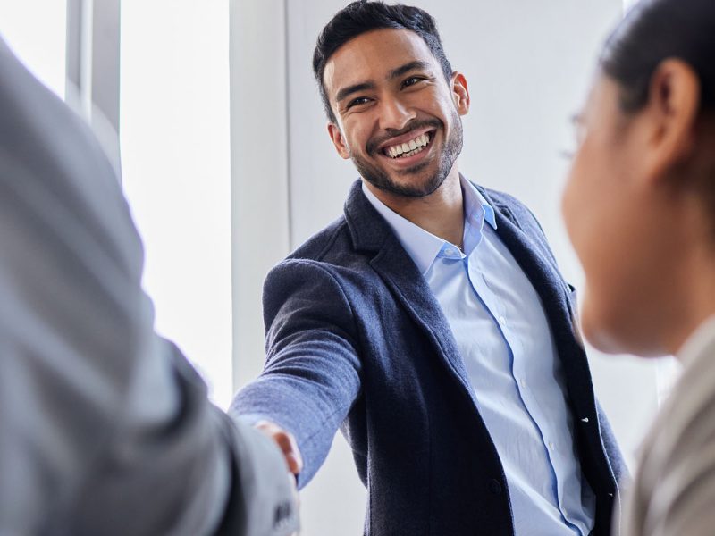 Shot of two business people shaking hands during a meeting Pleased to meet you