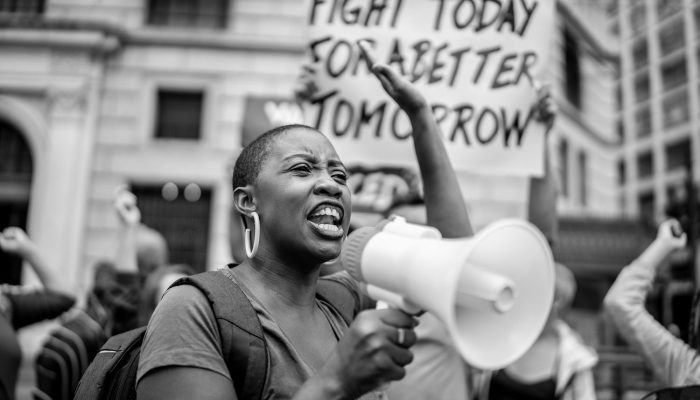 Activists doing a demonstration outdoors