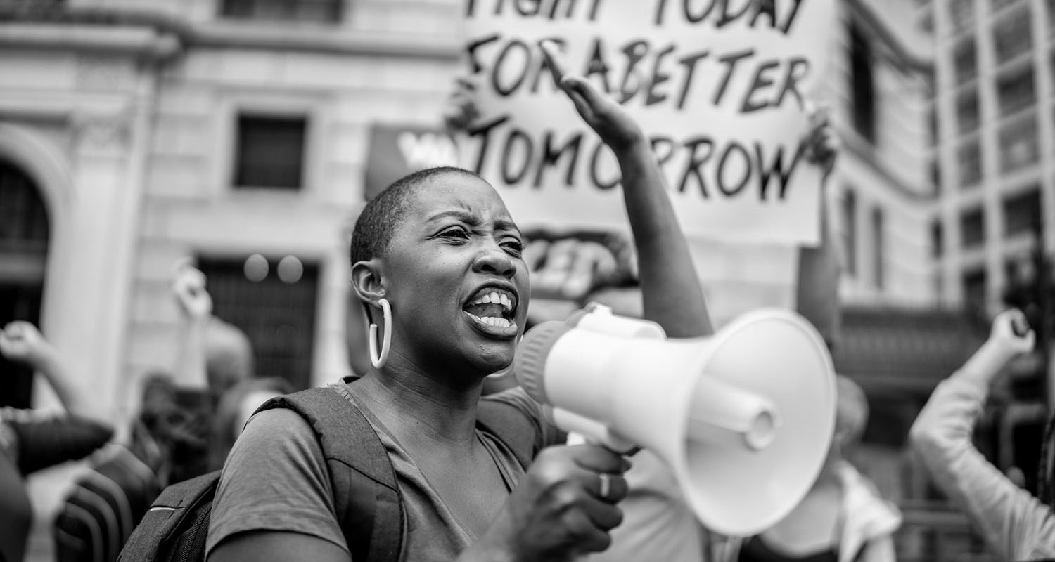 Activists doing a demonstration outdoors