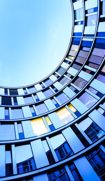 Glass facade of a modern office building in Hamburg, Germany.