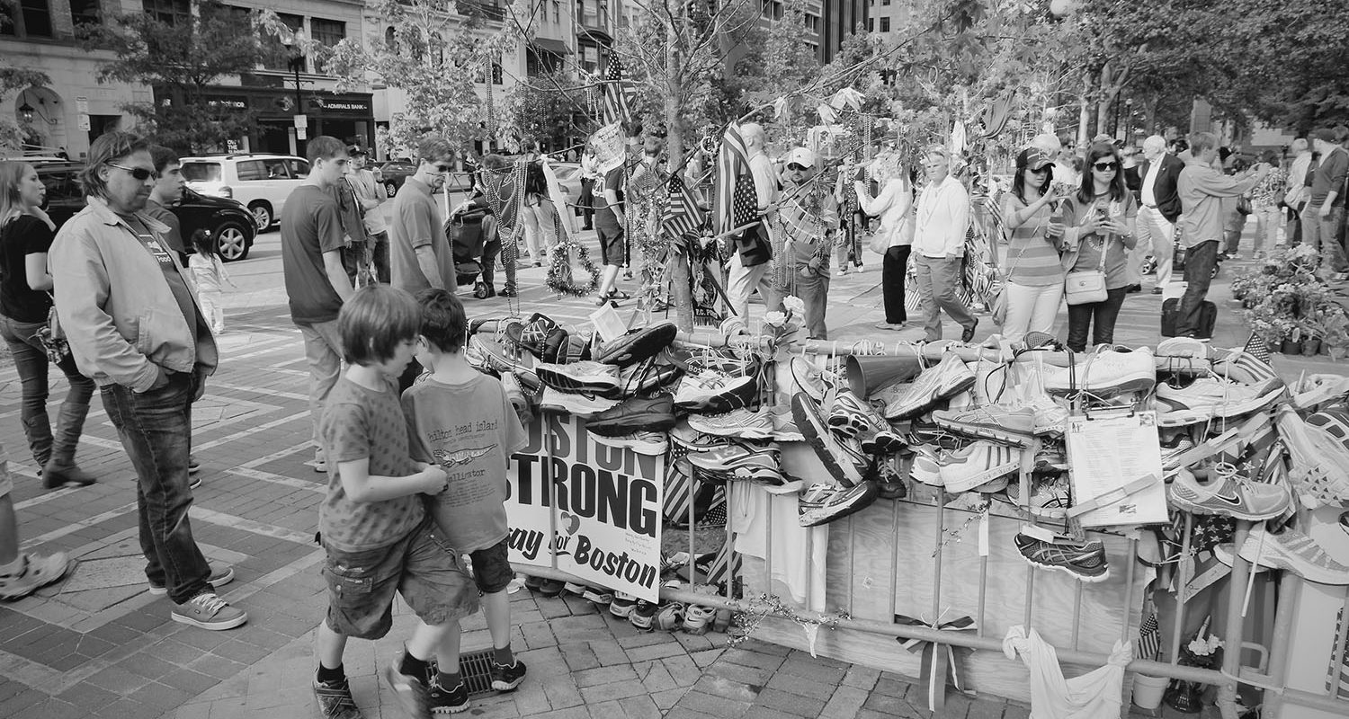 Boston, United States - June 8, 2013: People commemorate bombing victims in Boston. Terrorist attack took place during famous Boston Marathon on April 15, 2013.