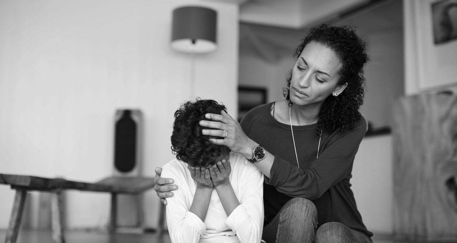 Cropped shot of a mother comforting her little son at home